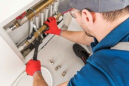 Plumber with tools, plumbing insurance